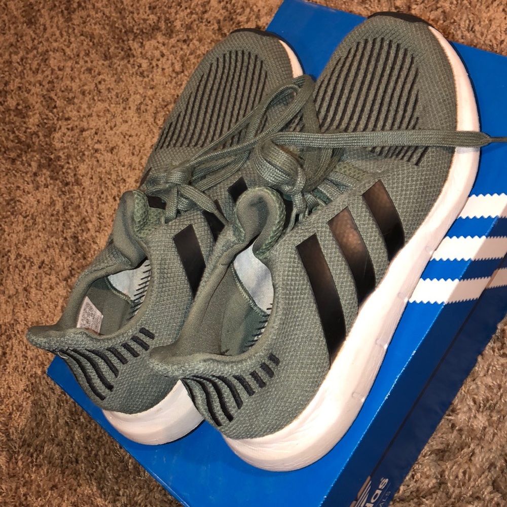 Green,black, and white adidas